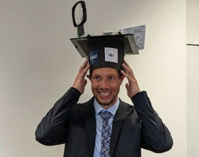 Moritz Gütlein with graduation cap