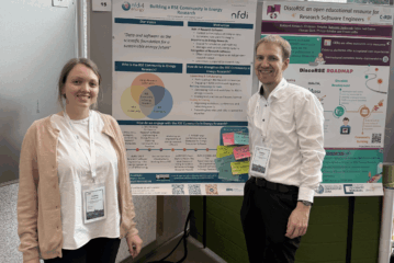 Participatios in front of presentation board