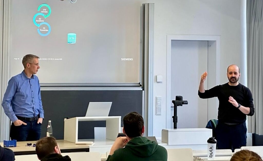 Guest speaker (le), Dr. Loui Al Sardy (ri) during his remarks on the topic